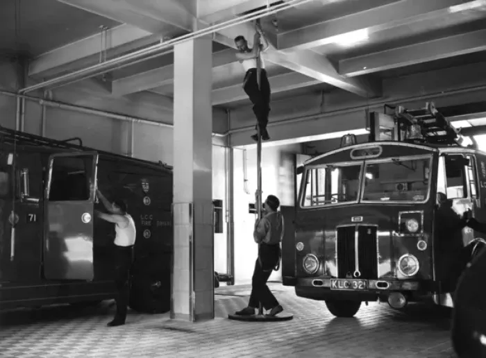 Framed Print : London firefighters sliding down a pole Framed Print : London firefighters sliding down a pole