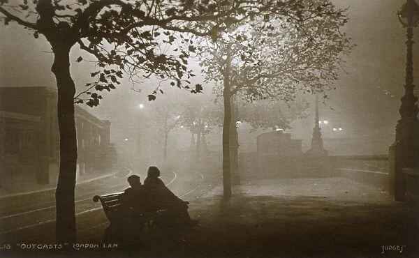 London at night - Two outcasts sit on a bench - Embankment
