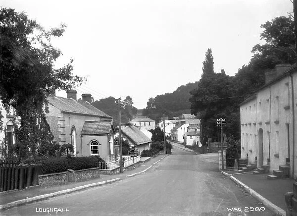 Loughgall - a deserted street scene showing buildings either side of the road