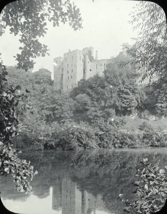 Framed Print : Ludlow - view across river, Ludlow castle behind trees. Framed Print : Ludlow - view across river, Ludlow castle behind trees.