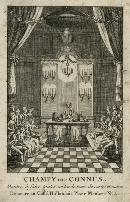 Framed Print : Magician performing the cup and balls trick in front of a se Framed Print : Magician performing the cup and balls trick in front of a se