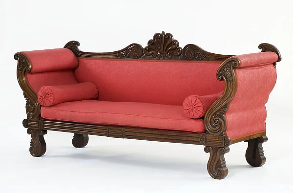 Sofa. Mahogany sofa carved with scrolls and an anthemion cresting