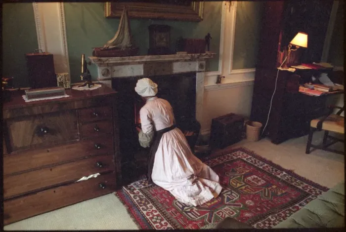 Framed Print : Maid Tends to Fire Framed Print : Maid Tends to Fire