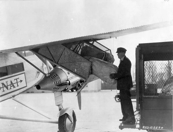 Mail being loaded into a Ford Tri-Motor circa 1930
