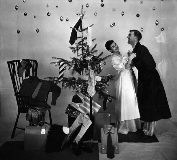 Male and female models in Christmas morning scene