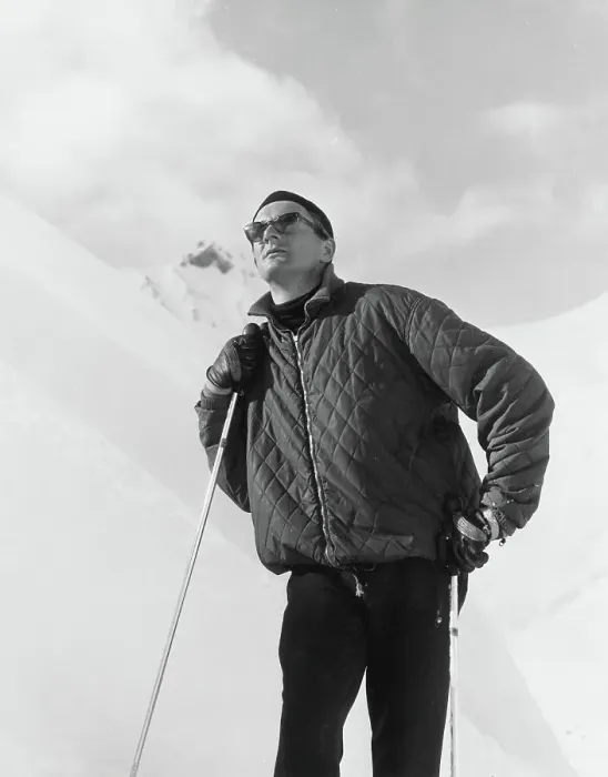 Framed Print : A male skier wearing a quilted jacket poses on the slopes. Date: late 1960s Framed Print : A male skier wearing a quilted jacket poses on the slopes. Date: late 1960s