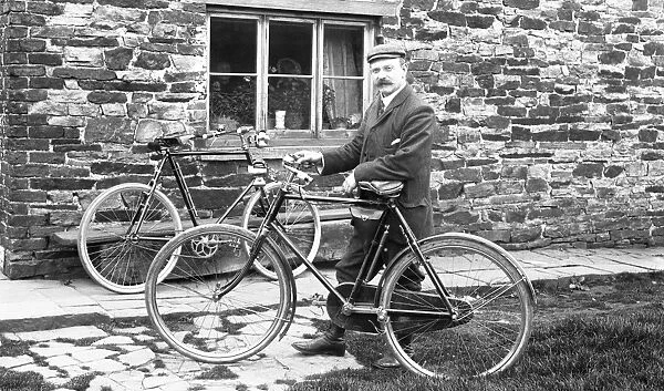 Man with bicycles outside house