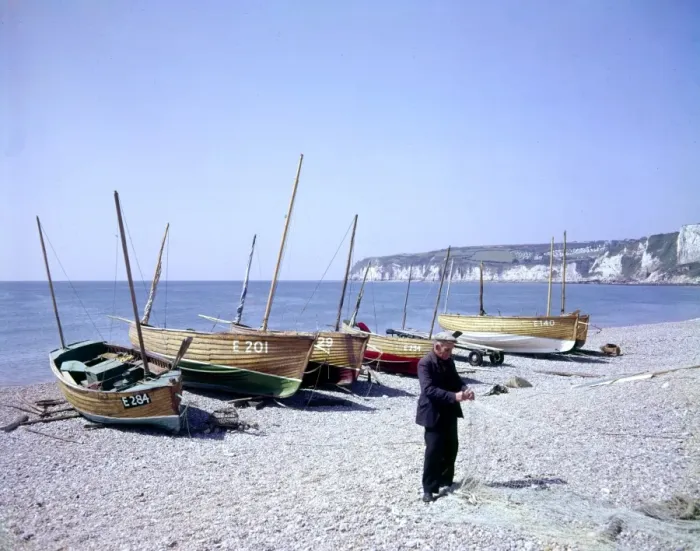 Framed Print : Man with boats and fishing nets at Seaton, Devon Framed Print : Man with boats and fishing nets at Seaton, Devon