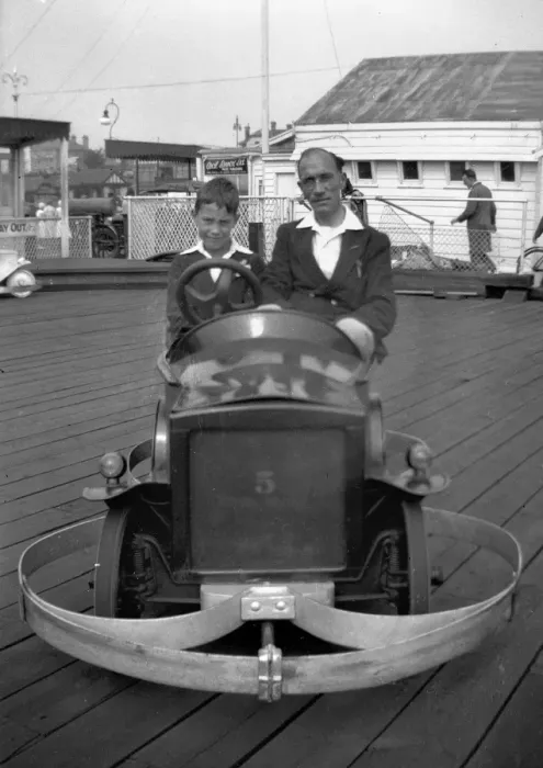 Framed Print : Man and boy in dodgem car Framed Print : Man and boy in dodgem car