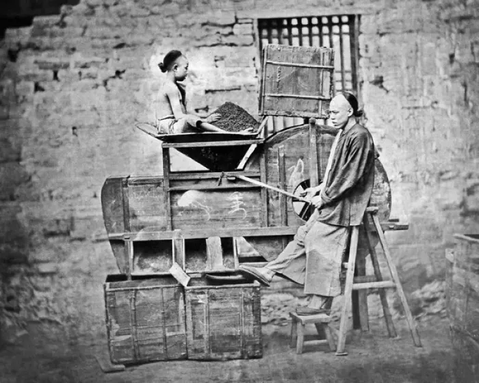 Framed Print : Man and boy sifting tea, China Framed Print : Man and boy sifting tea, China