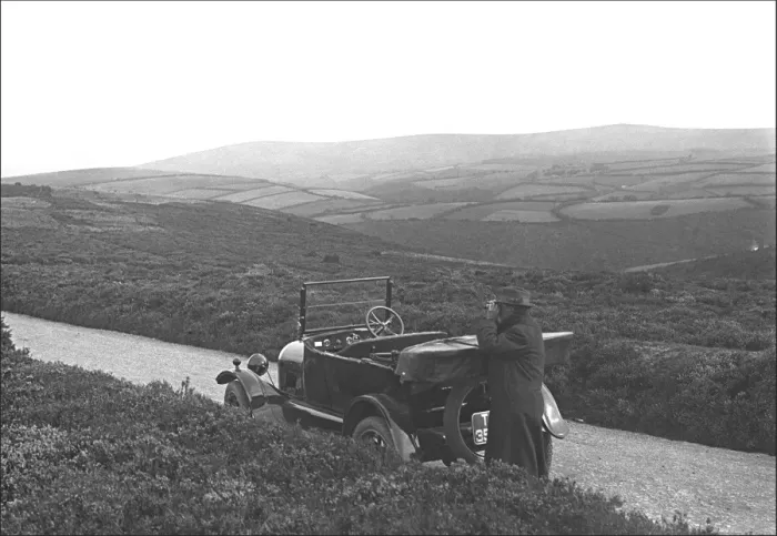 Framed Print : Man and car on a country lane in Devon Framed Print : Man and car on a country lane in Devon