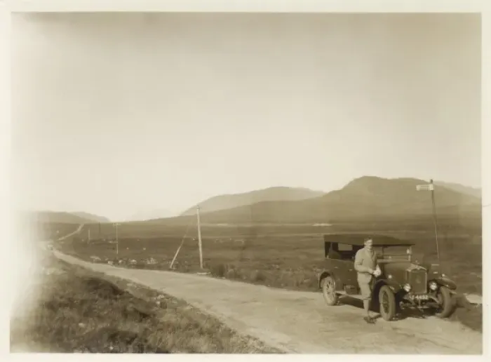 Framed Print : Man and car in the Scottish Highlands Framed Print : Man and car in the Scottish Highlands