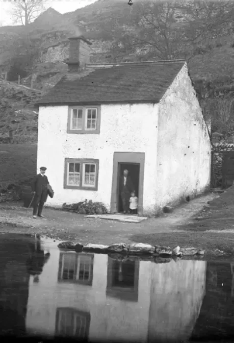 Framed Print : Man and child at door of riverside cottage in Alport, Derbys Framed Print : Man and child at door of riverside cottage in Alport, Derbys