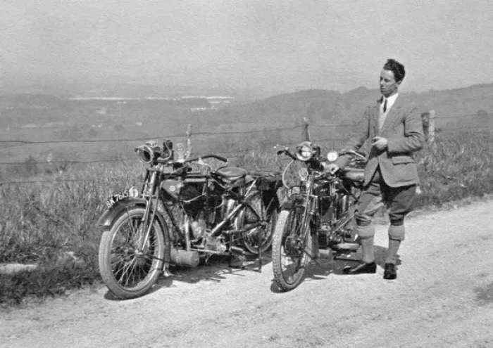 Framed Print : Man on country lane with two motorbikes Framed Print : Man on country lane with two motorbikes