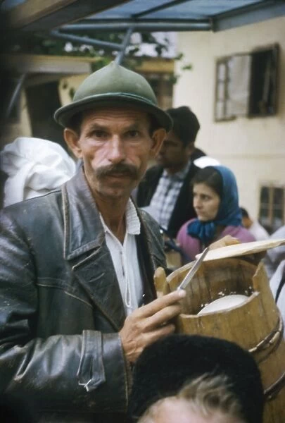 Man in a crowd in a Yugoslavian street