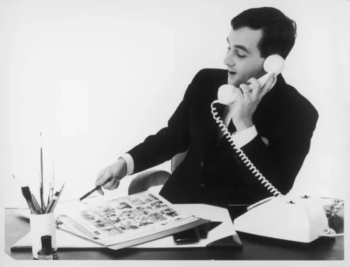 Framed Print : Man at Desk on Phone Framed Print : Man at Desk on Phone