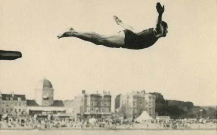 Framed Print : Man diving at a seaside resort Framed Print : Man diving at a seaside resort