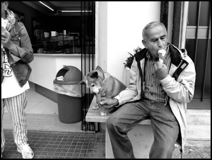 Framed Print : Man and dog both eating ice cream Italy Framed Print : Man and dog both eating ice cream Italy