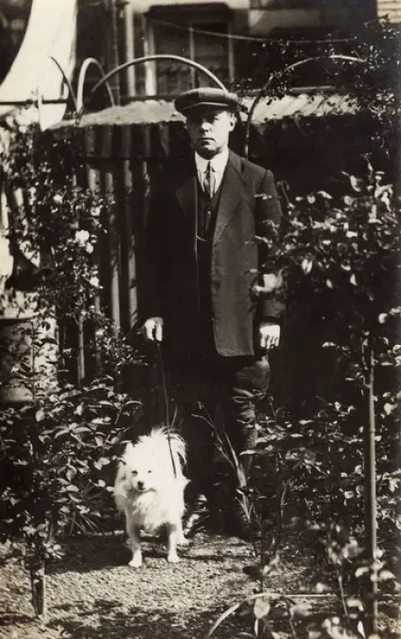 Framed Print : Man with a dog in a garden Framed Print : Man with a dog in a garden
