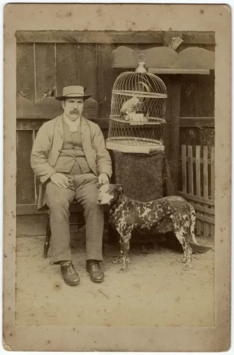 Framed Print : Man with dog and parrot Framed Print : Man with dog and parrot