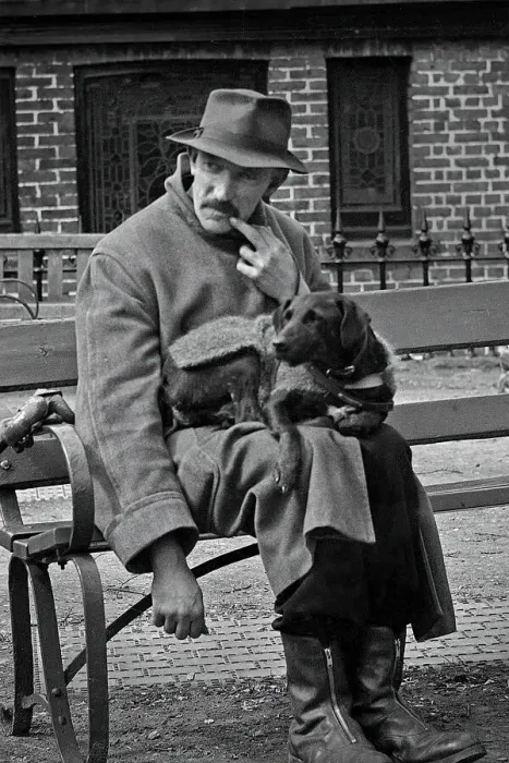 Framed Print : Man and dog resting on a bench Framed Print : Man and dog resting on a bench