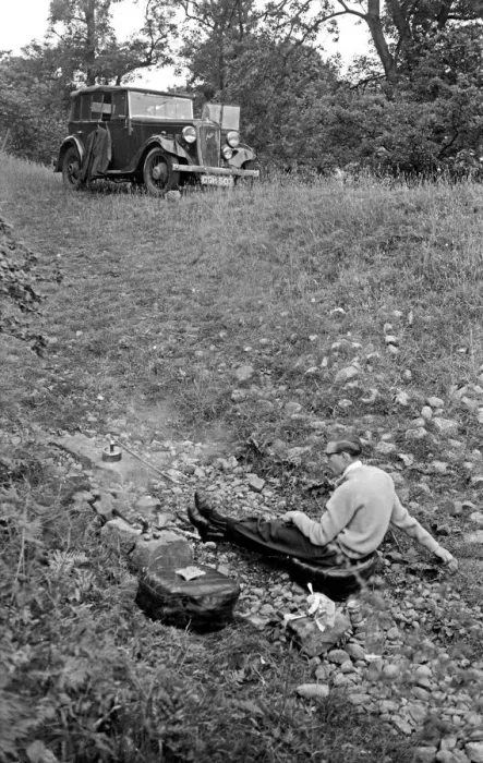 Framed Print : Man in a field with parked car Framed Print : Man in a field with parked car