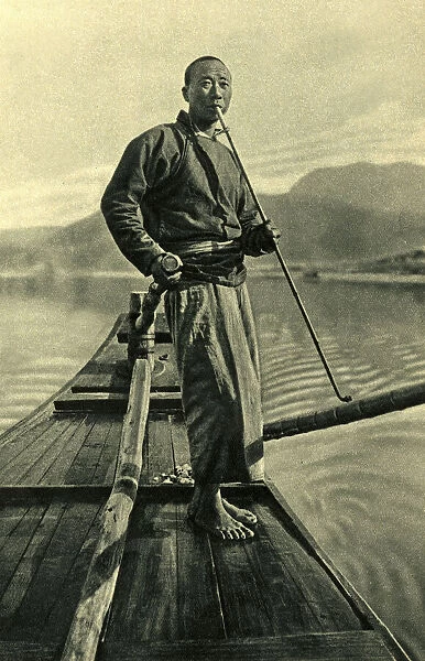 Man on his fishing boat, China, East Asia