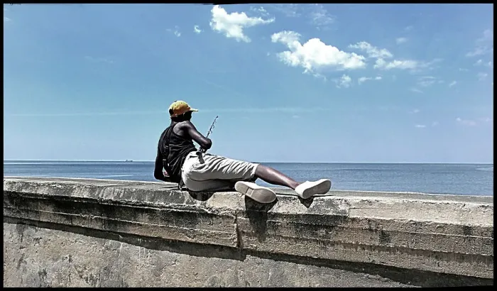 Framed Print : Man fishing of harbour wall, Havana, Cuba Framed Print : Man fishing of harbour wall, Havana, Cuba