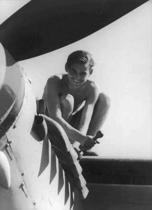 Framed Print : Man fixing an aeroplane