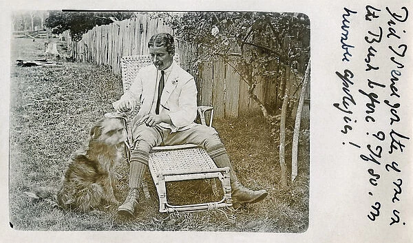 Man in garden chair with pet dog
