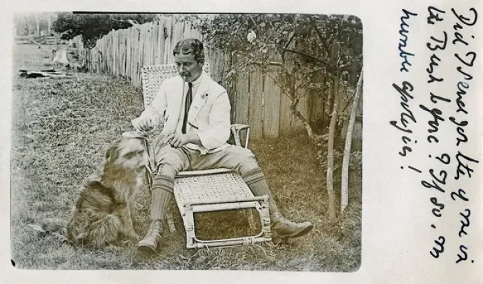 Framed Print : Man in garden chair with pet dog Framed Print : Man in garden chair with pet dog