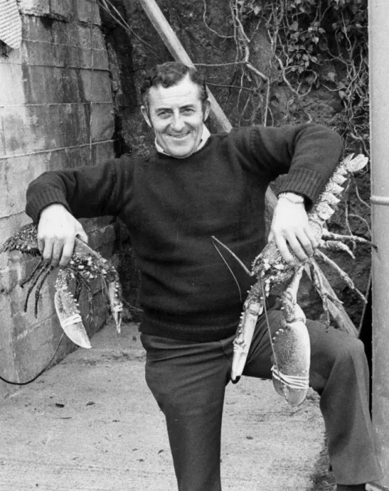 Framed Print : Man holding two large lobsters Framed Print : Man holding two large lobsters