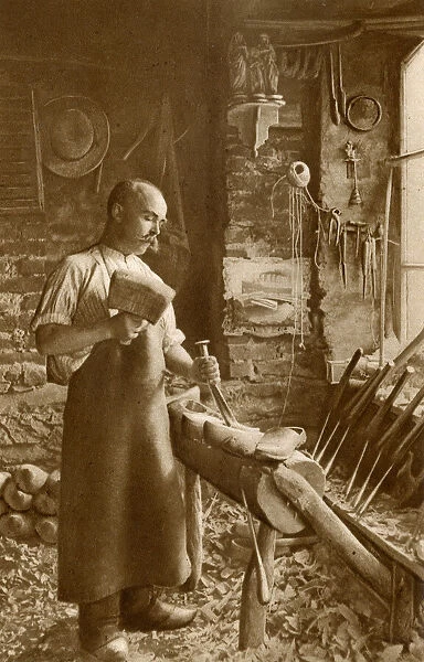 Man making wooden shoes, Brittany, Northern France