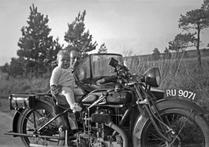 Framed Print : Man with motorbike and baby Framed Print : Man with motorbike and baby
