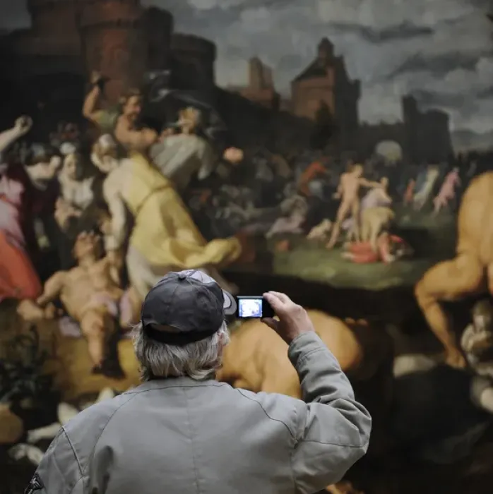 Framed Print : Man photographing a painting Framed Print : Man photographing a painting