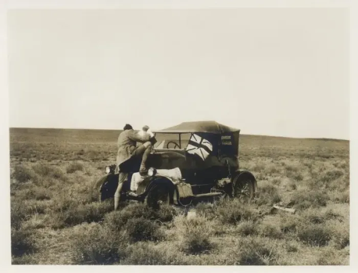 Framed Print : Man pouring water into car radiator, Middle East Framed Print : Man pouring water into car radiator, Middle East