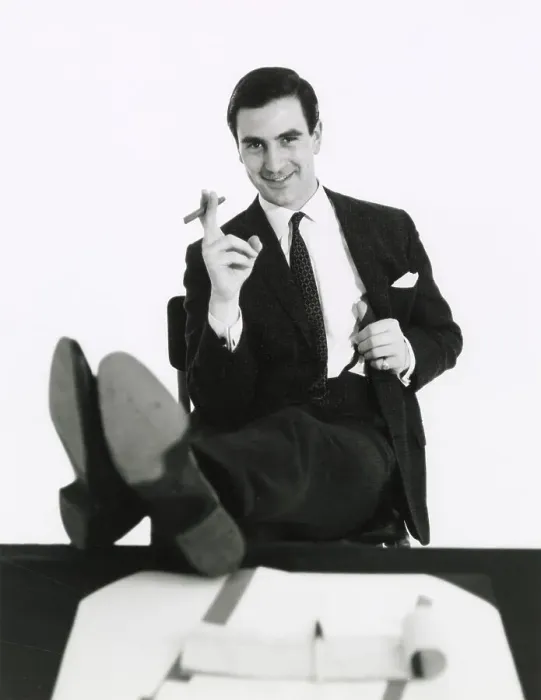 Framed Print : A man puts his feet up on his desk as he smokes a cigar. Date: late 1960s Framed Print : A man puts his feet up on his desk as he smokes a cigar. Date: late 1960s
