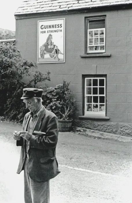 Framed Print : Man rolling cigarette in the street, Ireland Framed Print : Man rolling cigarette in the street, Ireland