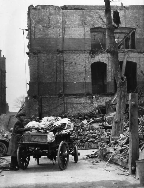 Man with salvage cart, London, WW2