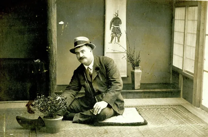 Framed Print : Man seated on the floor in a Japanese house Framed Print : Man seated on the floor in a Japanese house
