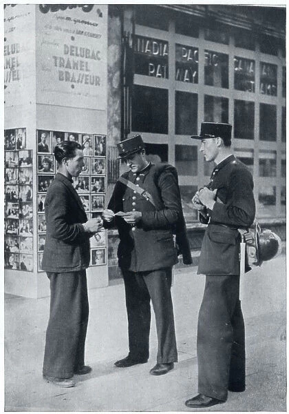 Man shows identity papers to gendarmes, September 1939