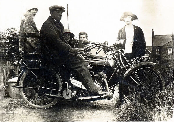 Man sitting on a 1921  /  22 Blackburne motorcycle & sidecar
