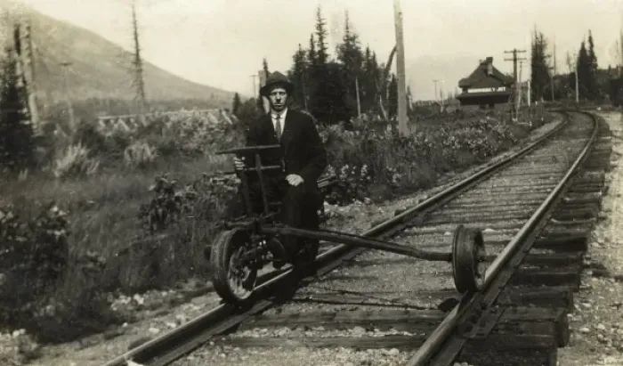 Framed Print : A man sitting on part of a modified railway suspension Framed Print : A man sitting on part of a modified railway suspension