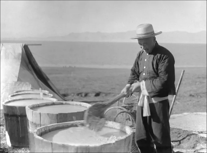 Framed Print : Man stirring vats in Kashgar, western China Framed Print : Man stirring vats in Kashgar, western China