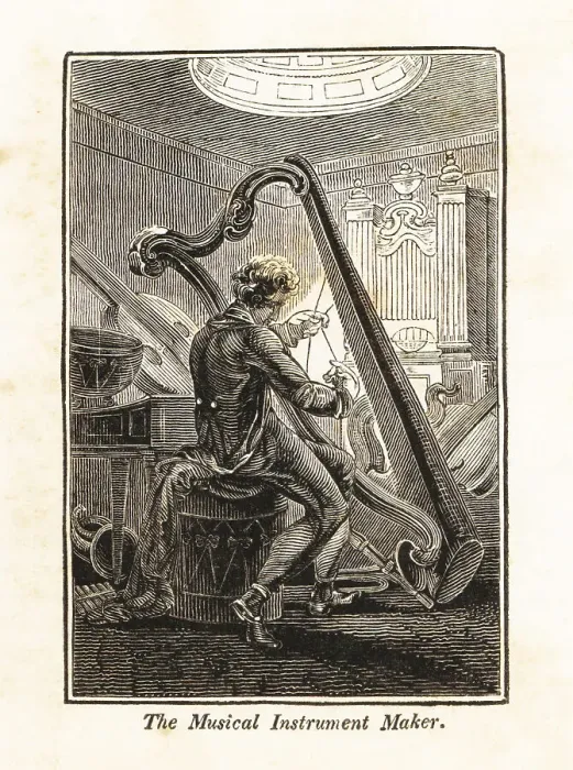 Framed Print : Man stringing a harp in a music workshop Framed Print : Man stringing a harp in a music workshop