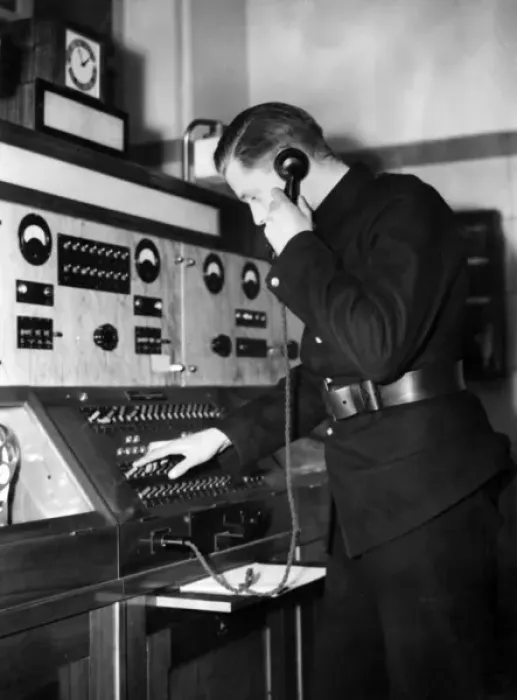 Framed Print : Man taking a call in a fire station control room Framed Print : Man taking a call in a fire station control room