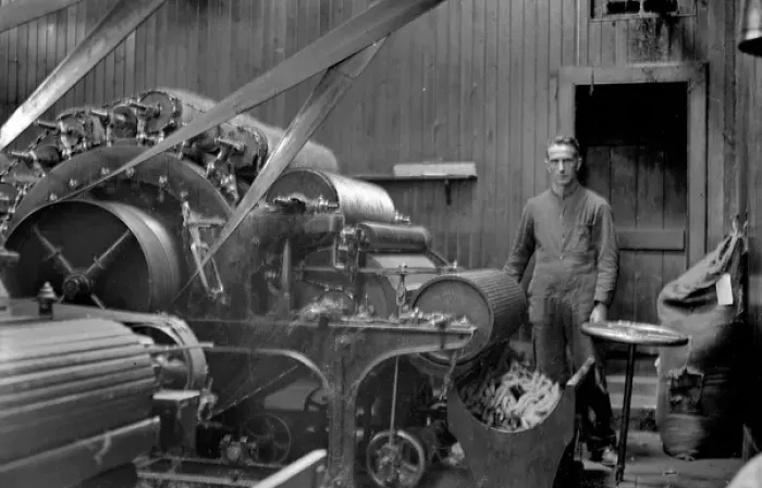 Framed Print : Man in textile industry operating machine, Scotland Framed Print : Man in textile industry operating machine, Scotland