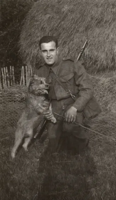Framed Print : Man in uniform with a terrier dog at a farm Framed Print : Man in uniform with a terrier dog at a farm