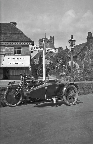 Man waiting in sidecar on a Sussex road