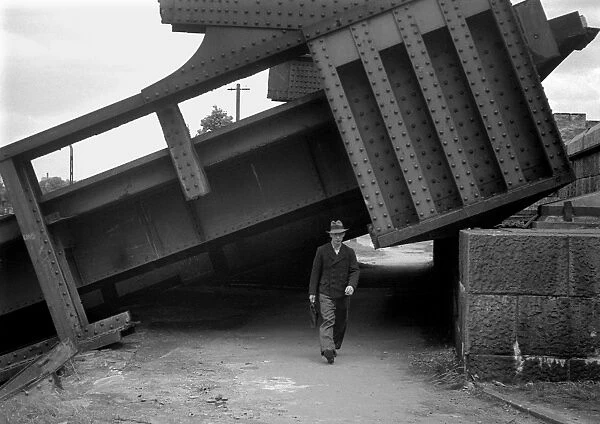 Man walking under collapsed structure, WW2
